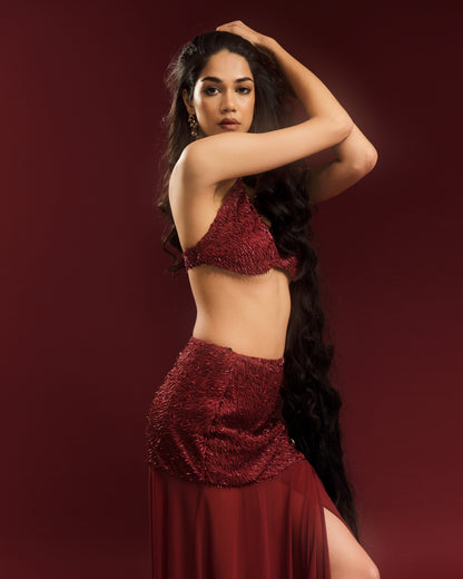Close-up of embellishments on the wine-red Durga halter blouse.
