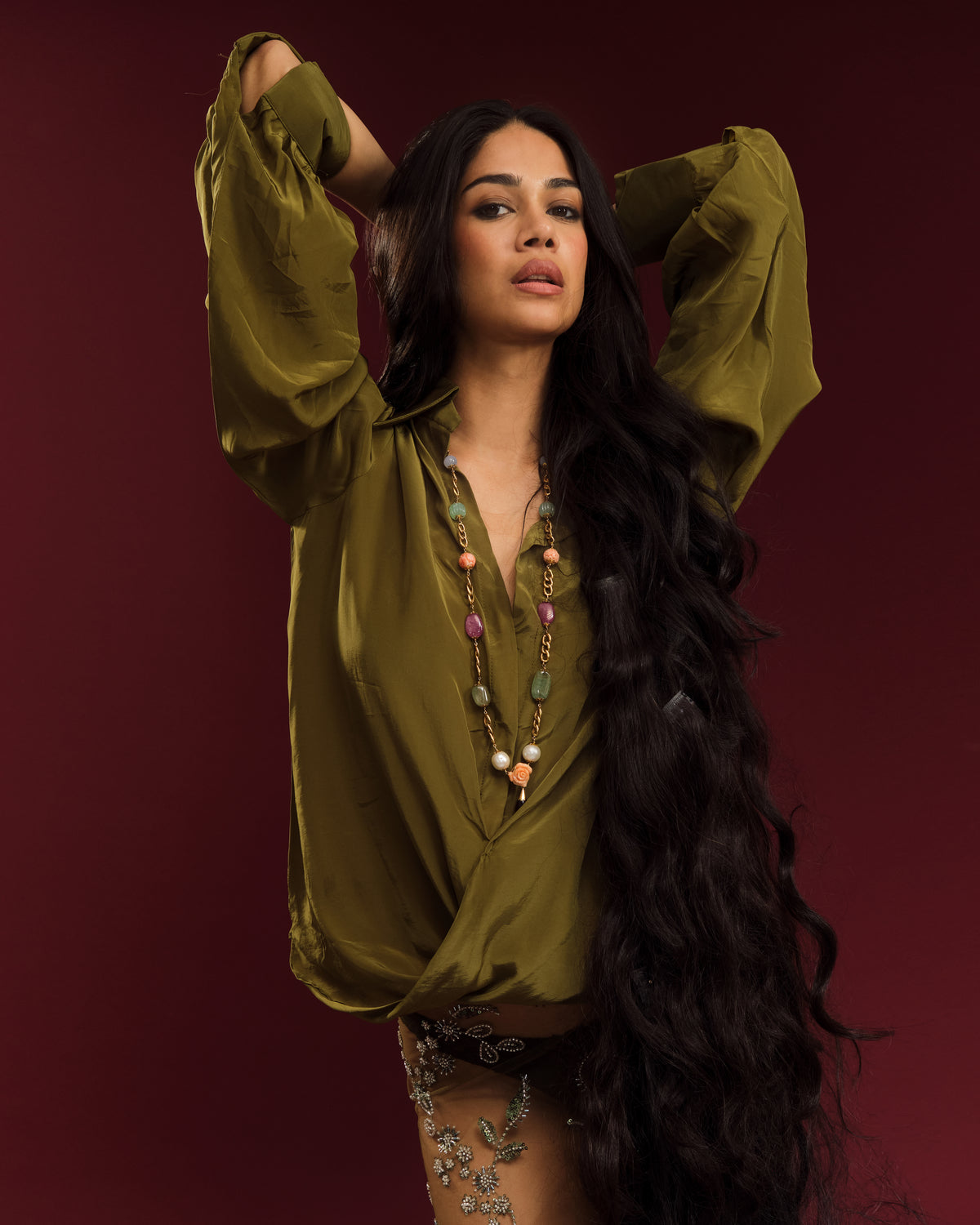 Oversized mehendi green shirt featuring sculptural draping, soft gathers and statement sleeves.
