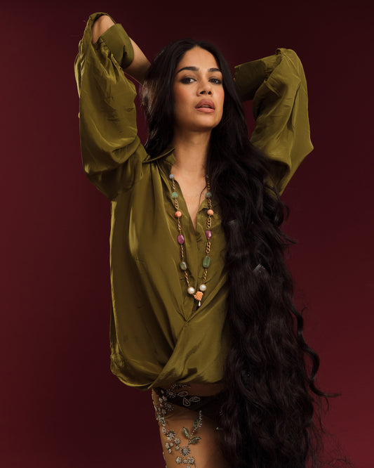 Oversized mehendi green shirt featuring sculptural draping, soft gathers and statement sleeves.
