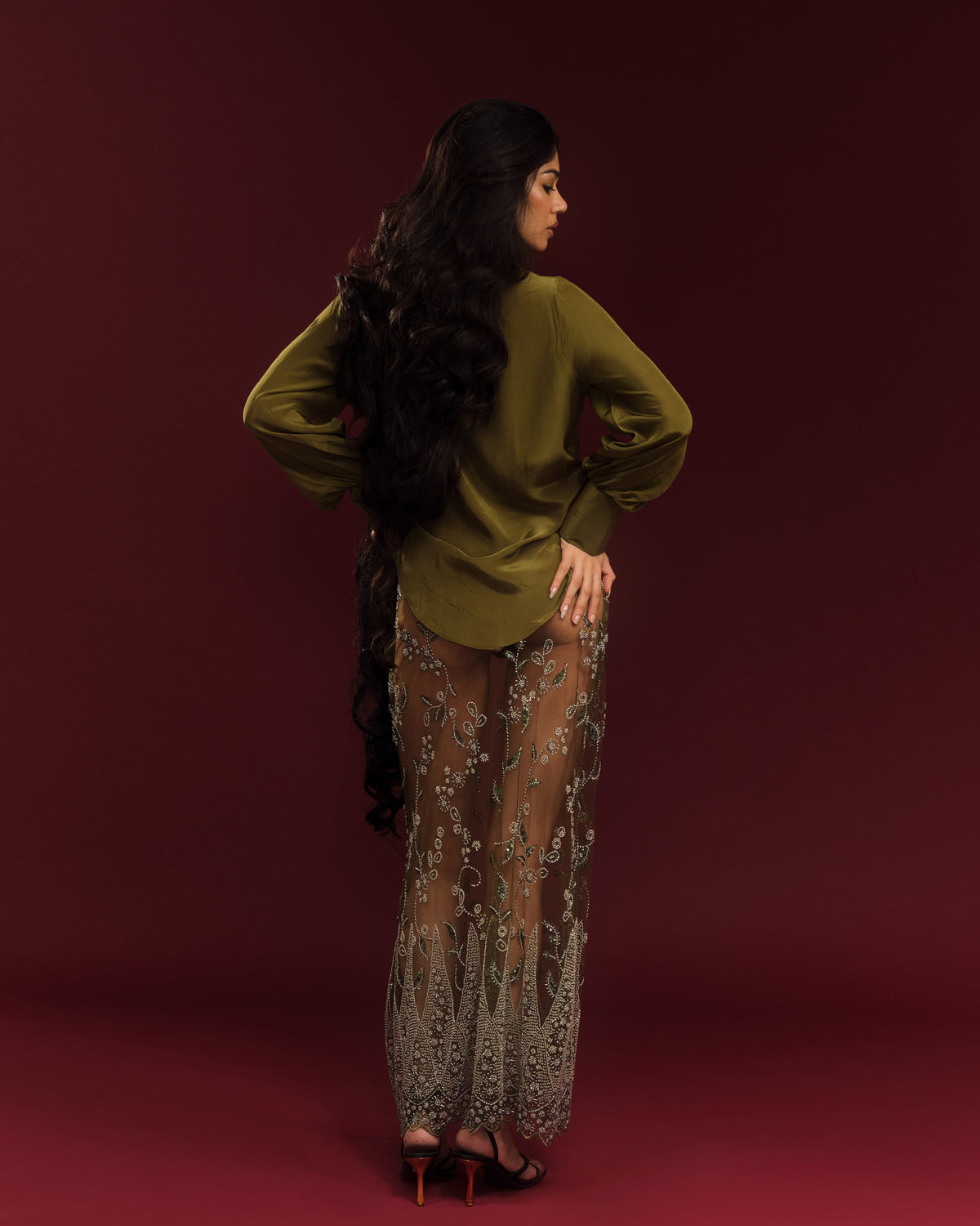 Sheer net maxi skirt featuring intricate hand-embroidered cutdana embellishments.
