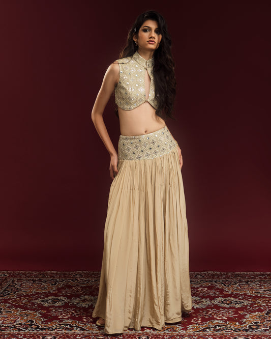 Champagne mirror-work blouse paired with a flowing silk-blend crepe maxi skirt.

