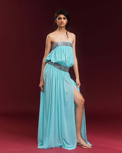 Turquoise hand-draped power mesh maxi dress featuring mirror embellishments and a high slit.