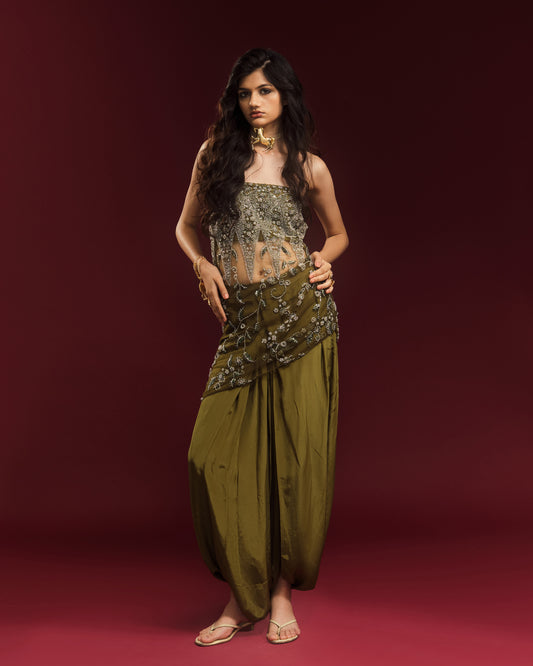 Model wearing mehendi green draped dhoti trousers with the embellished Rati Top.
